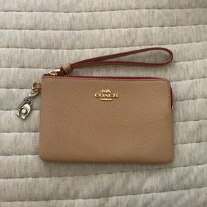 Nude pink Coach hand wallet